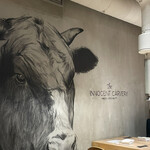 The INNOCENT CARVERY - 壁面の牛の絵
