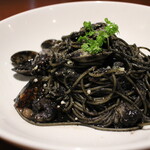 Homemade squid ink pasta slowly stewed with organic vegetables