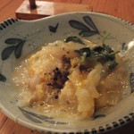 ととや - 「ぞうすい」（とり分け）：卓上の黒七味を添えて。煮玉ねぎの優しい甘さに抱かれ、ホッとします♪