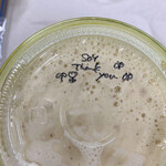 ミバショウ - 豆乳入りバナナジュース　カップの蓋に手書きで書かれたThank youの文字