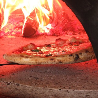 Authentic pizza baked in a wood-fired oven