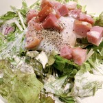 Caesar salad with diced bacon and hot spring eggs