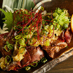 Toro liver covered with green onions