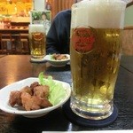 居酒屋ゆがふう - オリオン生ビールとお通し(鶏のから揚げ)