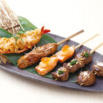 Assortment of five types of seasonal fresh fish and vegetable Grilled skewer