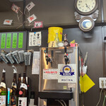 もつやき たろう - 芋焼酎も増えました！壁にはアルミ製のちろりが沢山！