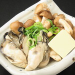 Grilled oysters and mushrooms with butter and soy sauce