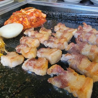 Thick-sliced samgyeopsal grilled on an authentic stone slab made in Korea is one of our specialties.