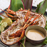 Whole grilled spiny lobster with a mild American sauce