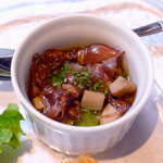 合掌レストラン 大藏 - 前菜の一品。季節先取りのほたるいかをアヒージョに。間違いなく、ワインが進みそうな味！