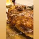 Grilled free-range chicken with herb butter served with organic vegetables