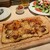 フランツクラブ - 料理写真:プルドポークのスパイシーフラムクーヘン 南ドイツの薄焼きピザ。美味し。
