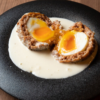 Our recommendation! Soft-boiled Scotch egg with truffle white sauce