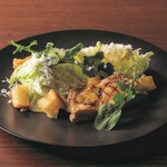 Caesar salad with grilled chicken and Parmigiano Reggiano