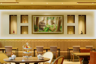 Cresson River Side Story - The spacious interior featuring a large painting that symbolizes our restaurant.