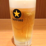 石庫門 - 生ビール（サッポロ生ビール黒ラベル〈樽生〉）