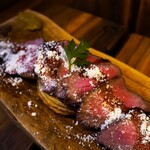 Charcoal-grilled tagliata of beef tataki