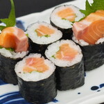Famous salmon roll covered in salmon roe
