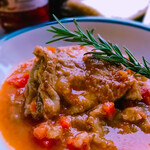 Chicken thighs and aromatic vegetables simmered in white wine