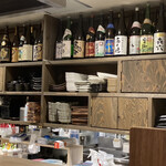 宮崎鶏料理まるしん - 店内には宮崎の焼酎がずらり