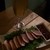 410kyodo - 料理写真:最近の新メニュー「合鴨のスモーク」480円。　これはタレ付きだけど、タレ無しで食べても美味い！！（もちろんタレを付けても美味しいですけどね☆）