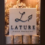 MONICA - 夜の店先は“ラチュレ”の看板に変わります。