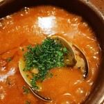 Donostia Comeru。 - 魚介の旨味が溶け込むトマトベースのスープに、トロトロのお米が入った雑炊風♪アサリや海老、タコに白身魚など具は少なめ