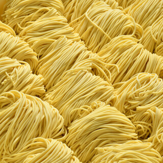 Homemade noodles made in the store's noodle workshop