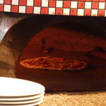 Fandango - 窯の中で調理中のピザ