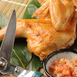 銀座 阿波おどり - 「阿波尾鶏豪快焼き」半身ごと焼き上げハサミで豪快に切り分けます