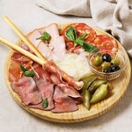 Assorted apero plate - ham, cheese, olives -