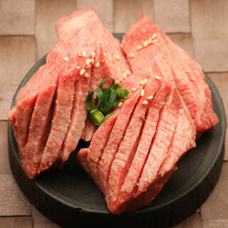 Raw thick-sliced tongue with salt
