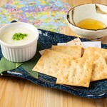 Saga soy milk cheese tofu served with crackers, honey or Kyushu soy sauce