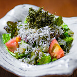 Salad with plenty of whitebait and green seaweed