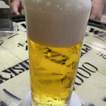 ビールスタンド重富 - 三度つぎ。もこもこ泡でゆっくり飲みたくなるマイルドな味。