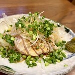 Seared local chicken covered in green onions