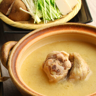 A Hot Pot pot with thick, cloudy and creamy chicken stock that you can only find at a specialty store.