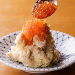 Homemade potato salad topped with salmon roe