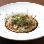 Black truffle cream risotto with Madeira sauce