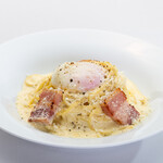 Rich carbonara with thick-sliced bacon and soft-boiled eggs