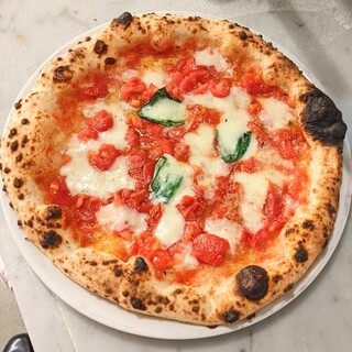 Authentic pizza baked in a Neapolitan wood-fired oven