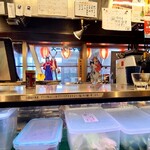 やきとり番長 - お店のカウンターから厨房　サマーウォーズのステッカー