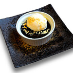 Black sesame brûlée served with vanilla ice cream