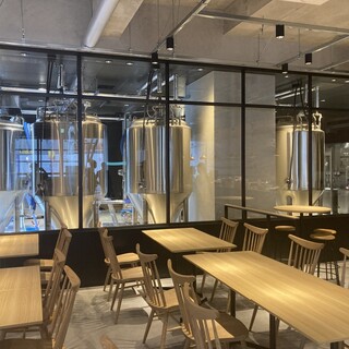 You can see the craft beer brewery from the modern Japanese interior and seating area!