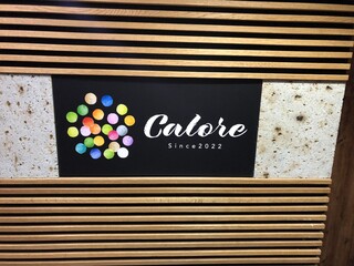 Calore - 階段を上がっていただいた入口看板です