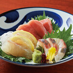 Assortment of three fresh fish sashimi dishes