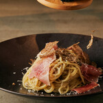 Cacio e pepe with black truffle and Prosciutto