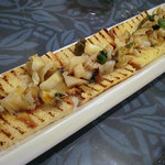 オステリアベーネ - 「根室産ツブとホタテのガーリックバターソテーブルスケッタ」1100円