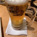 Yakiniku Kingu - 生ビールお代わり　お気遣いいただいたペーパータオルのコースター