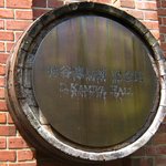 キャノン - 神谷傳兵衛記念館を示すエンブレム